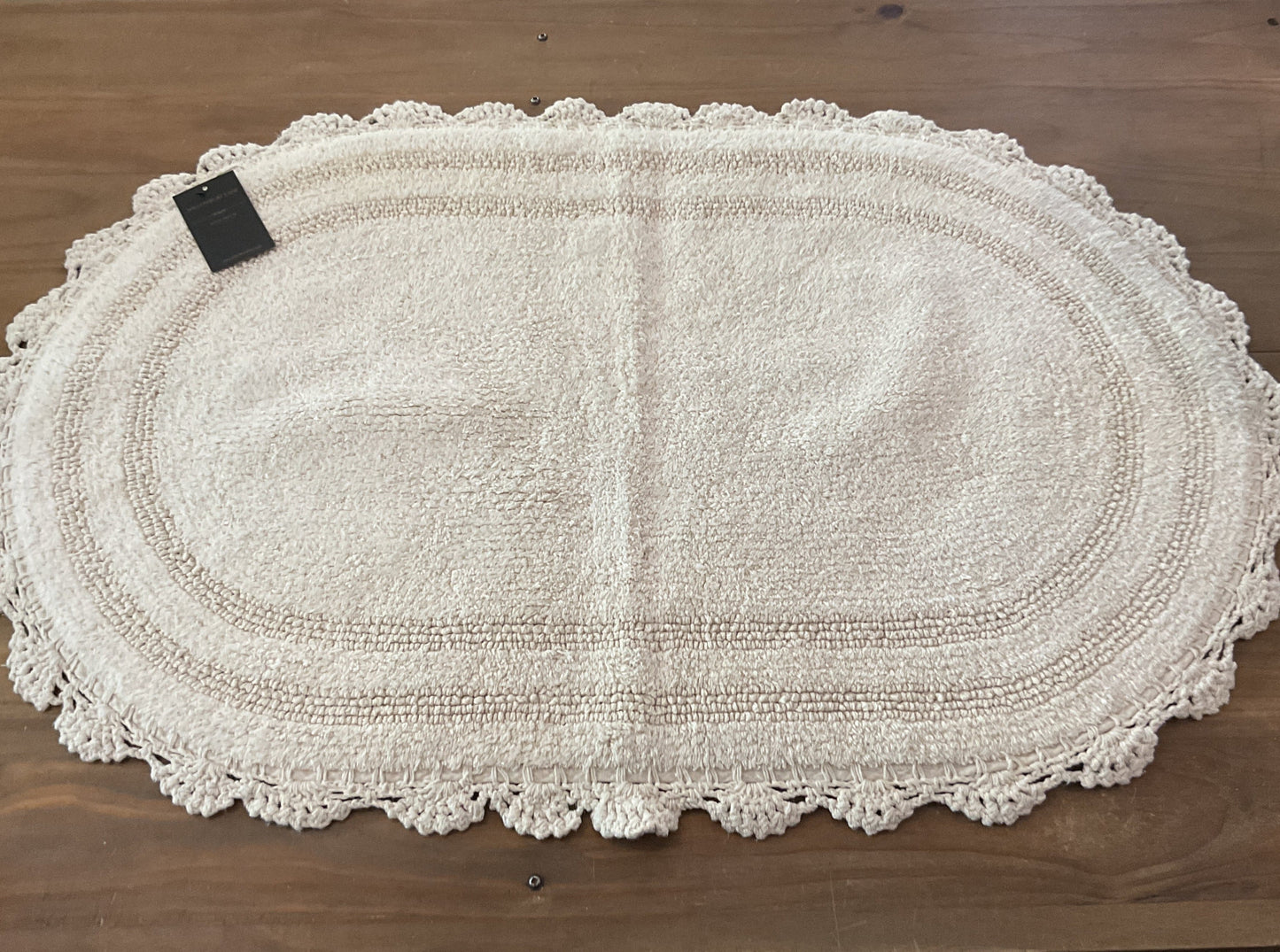 Crochet bath rug, ivory oval